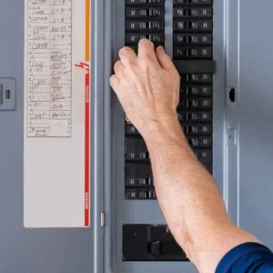 homeguide-resetting-circuit-breaker-in-main-electrical-panel