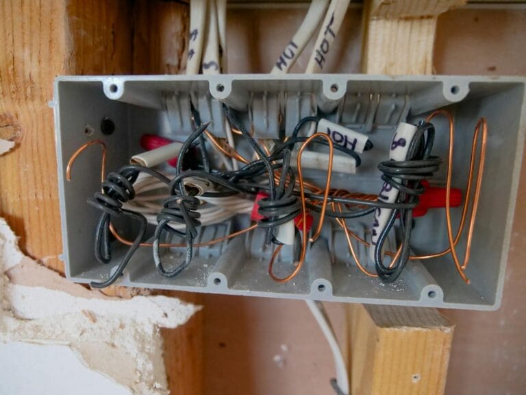 Detailed view of an open electrical switchboard withLine vs Load Wires cables.